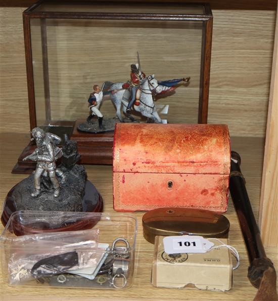 A collection of military related items and a cosh